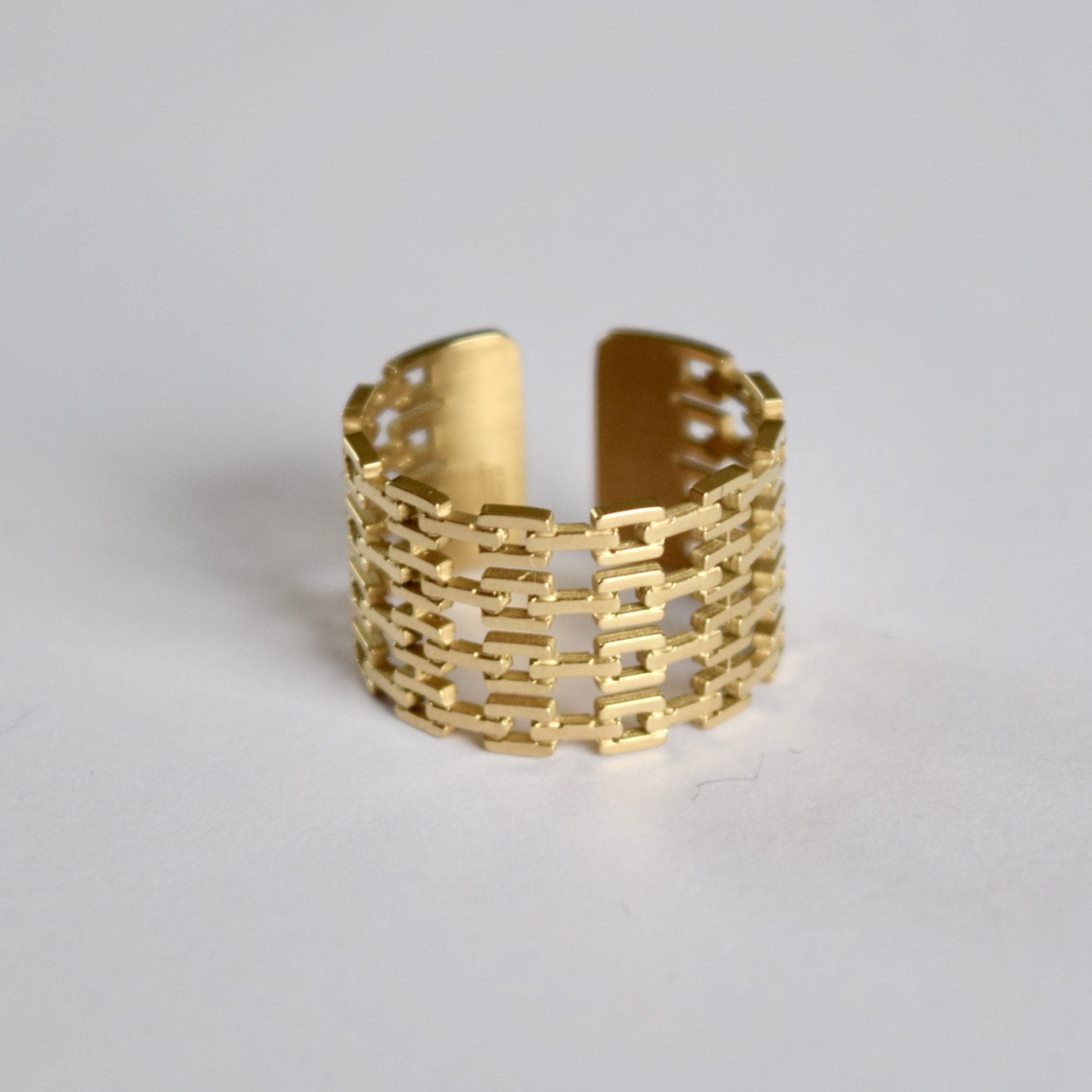 BAGUE LARGE ACIER DOREE 